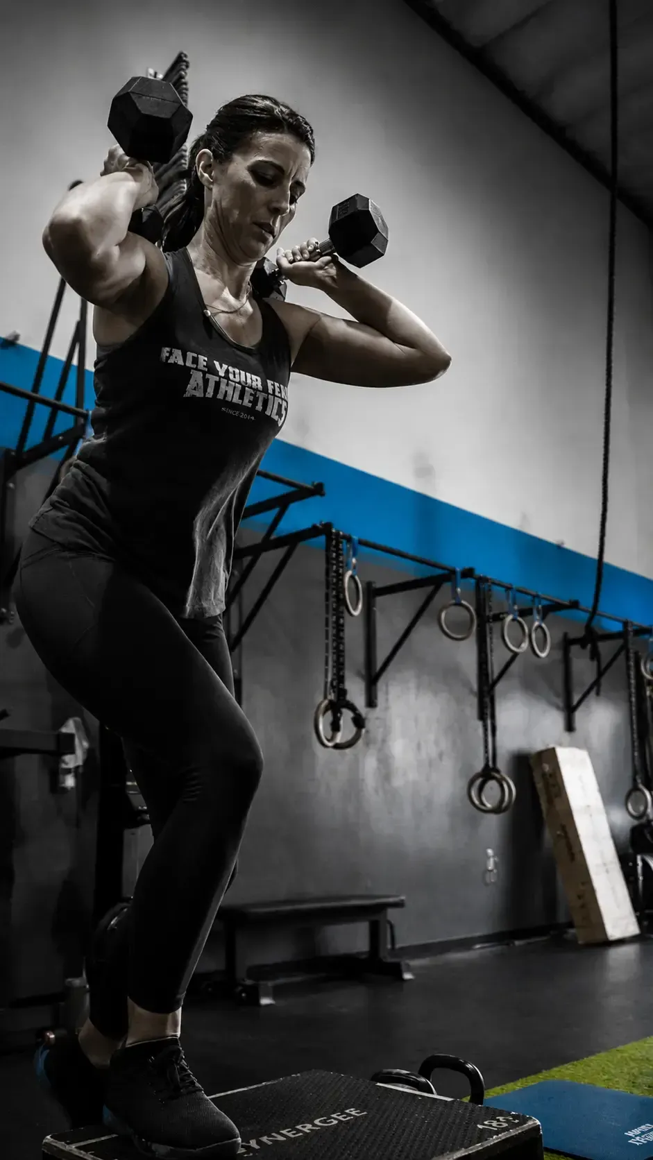 Adults lifting in a coached strength class at FYF Athletics