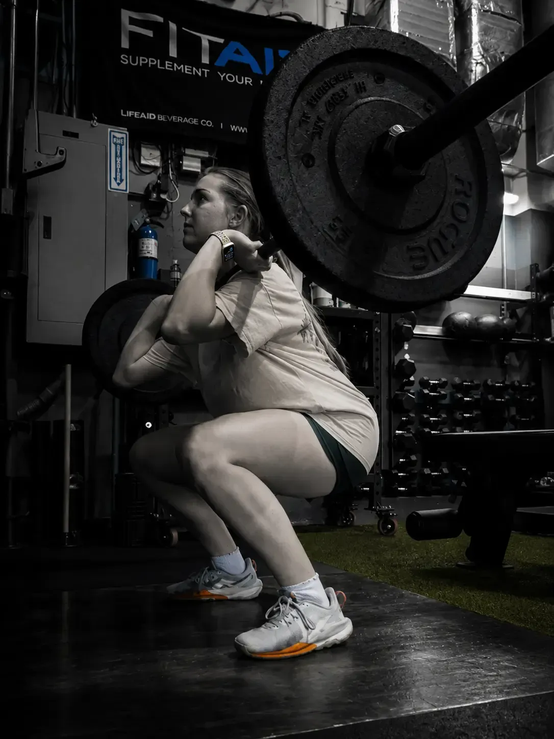 Athlete performing a barbell front squat as part of an individualized strength program at FYF Athletics